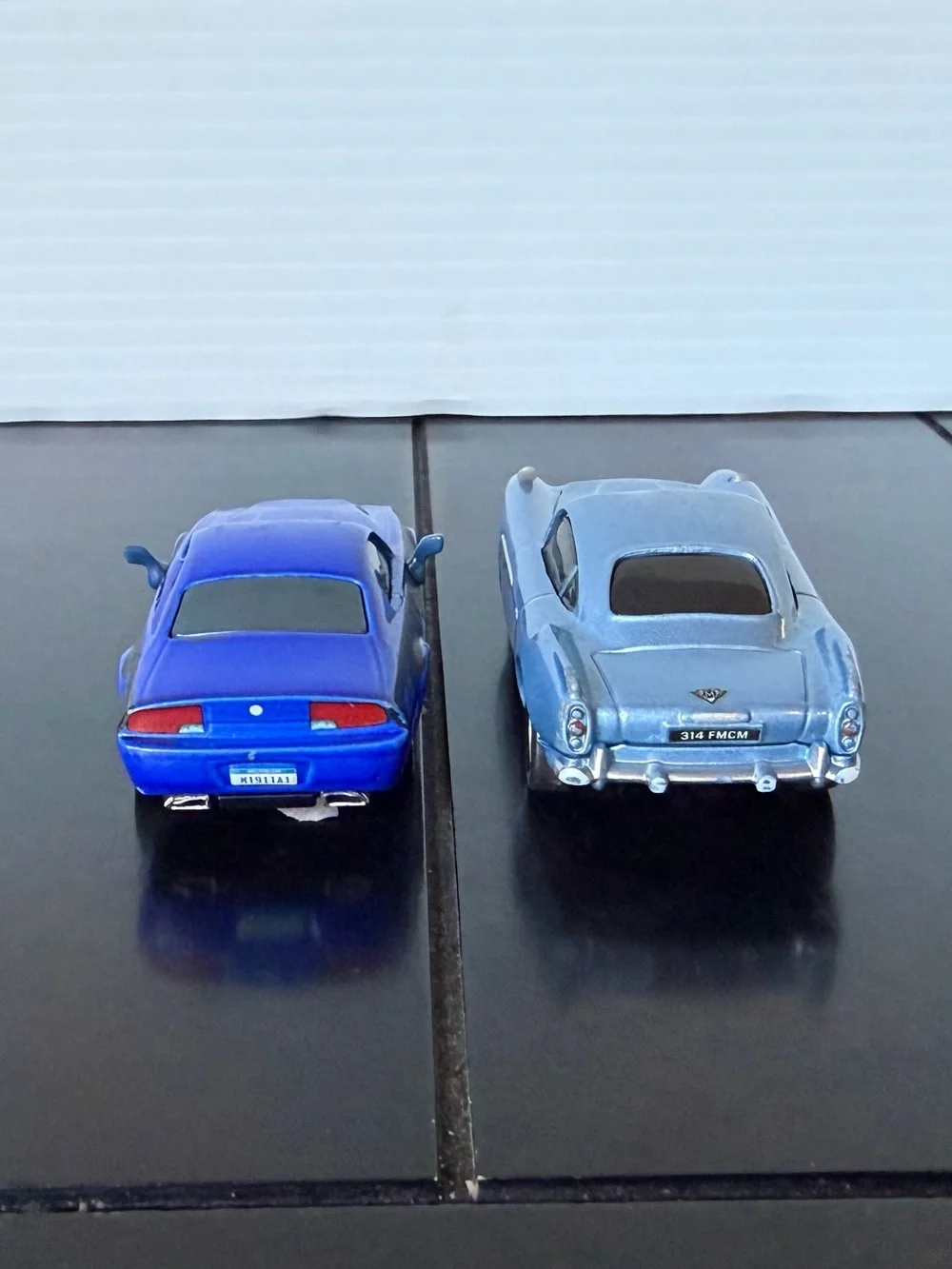 Disney Pixar Cars 2 Rod Torque Redline and Finn McMissile 1:55 diecast